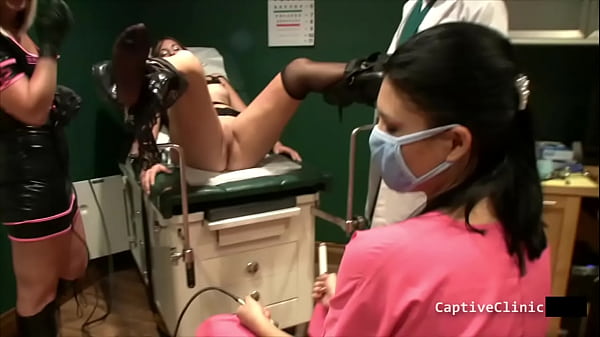 Crystal Frost And Angel Rose Both Get Tormented Side By Side As Doctor Tampa And Nurse Administer High Voltage Using A Violet Wand AtBondageClinicCom